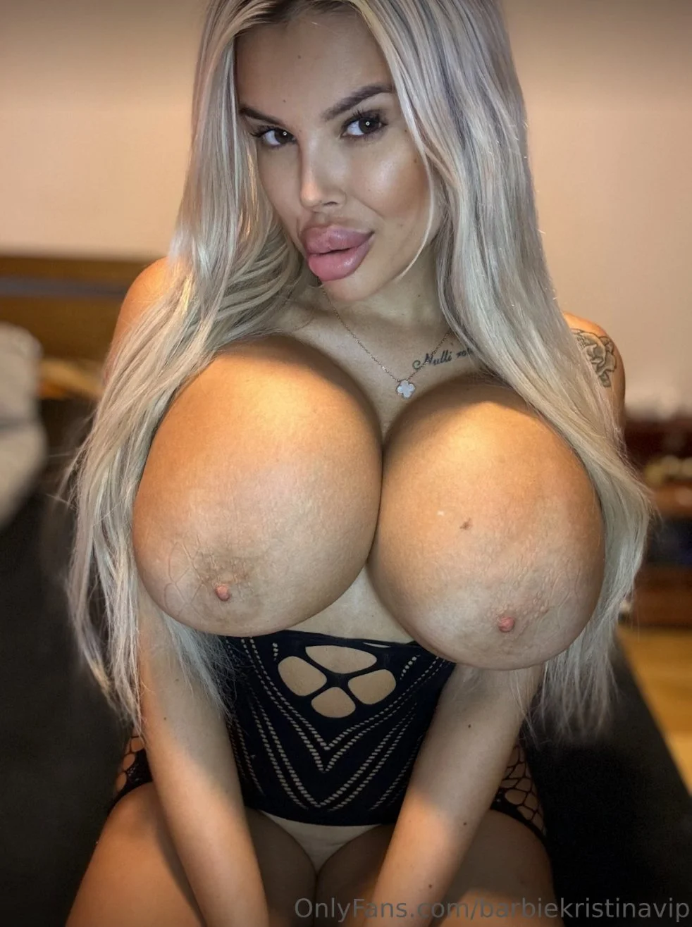 Blonde latina bimbo with giant fake tits image 9
