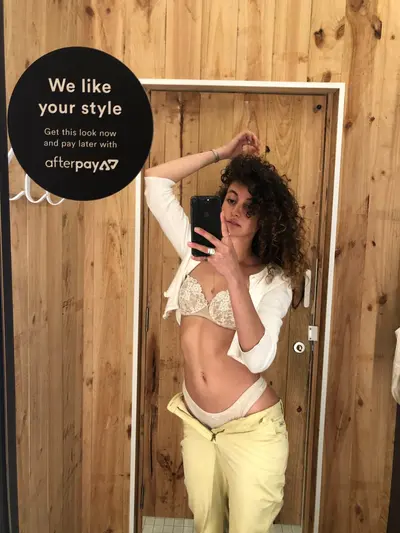 Lingerie fit check selfies in the fitting room cover image