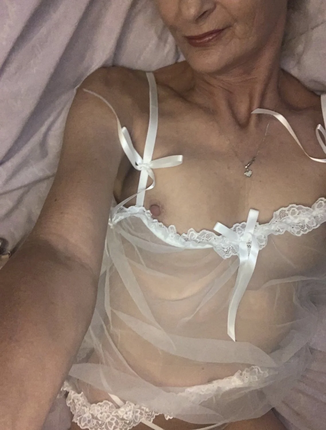 Sexy MILF in see through image 9