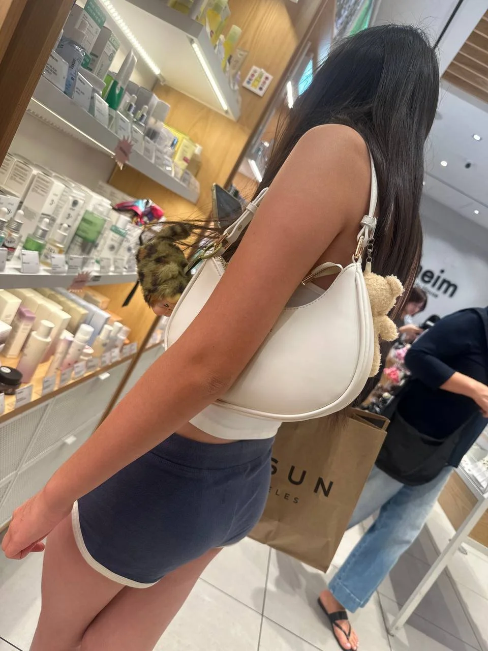 Creeping on asian teen in mini short part2 main image