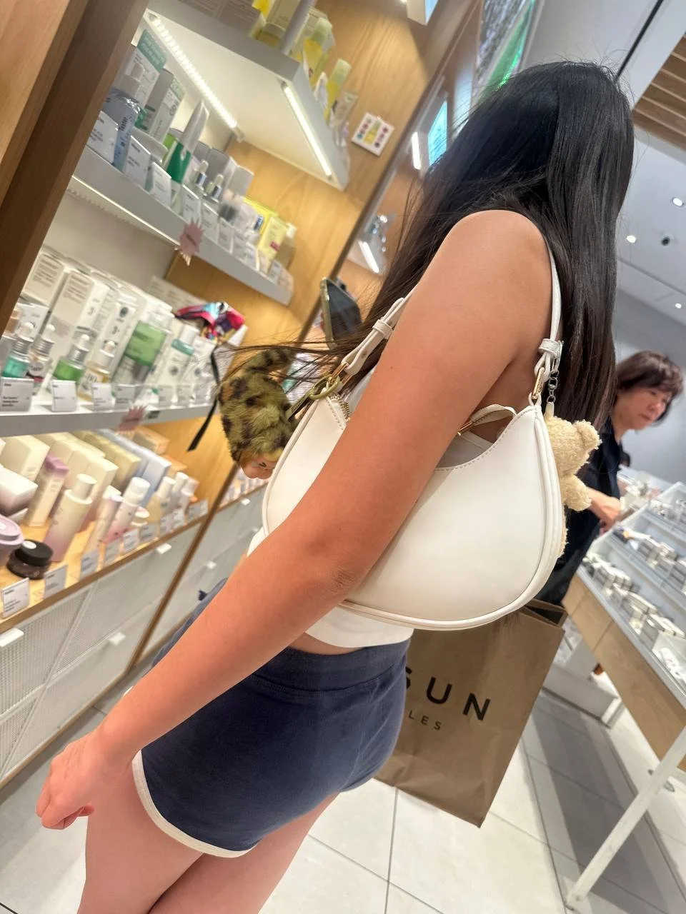 Creeping on asian teen in mini short part2 image 2