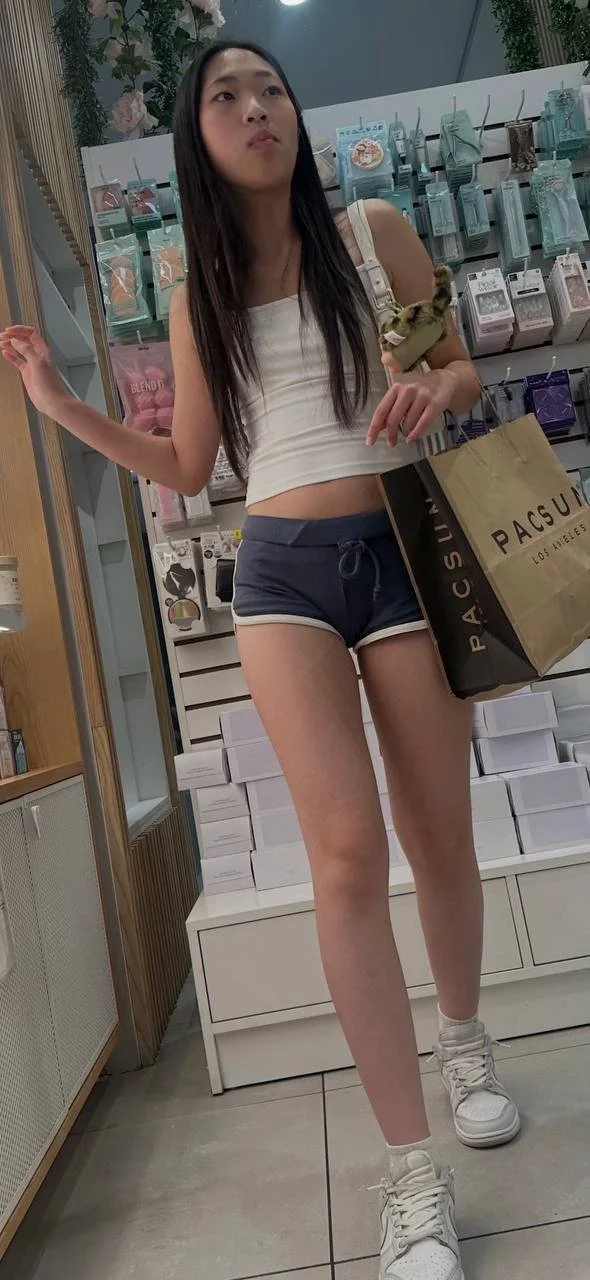 Creeping on asian teen in mini short part2 image 3
