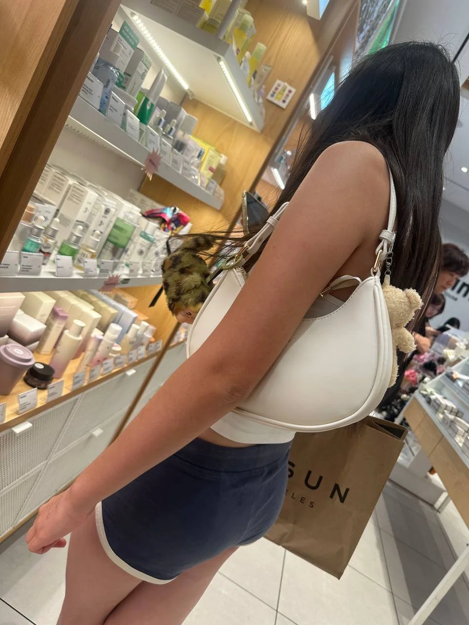 Creeping on asian teen in mini short part2 image 8