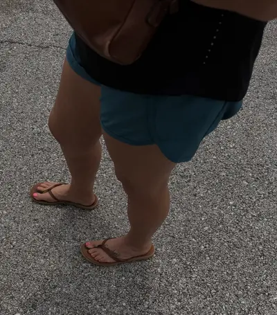 Woman’s feet in sandals cover image