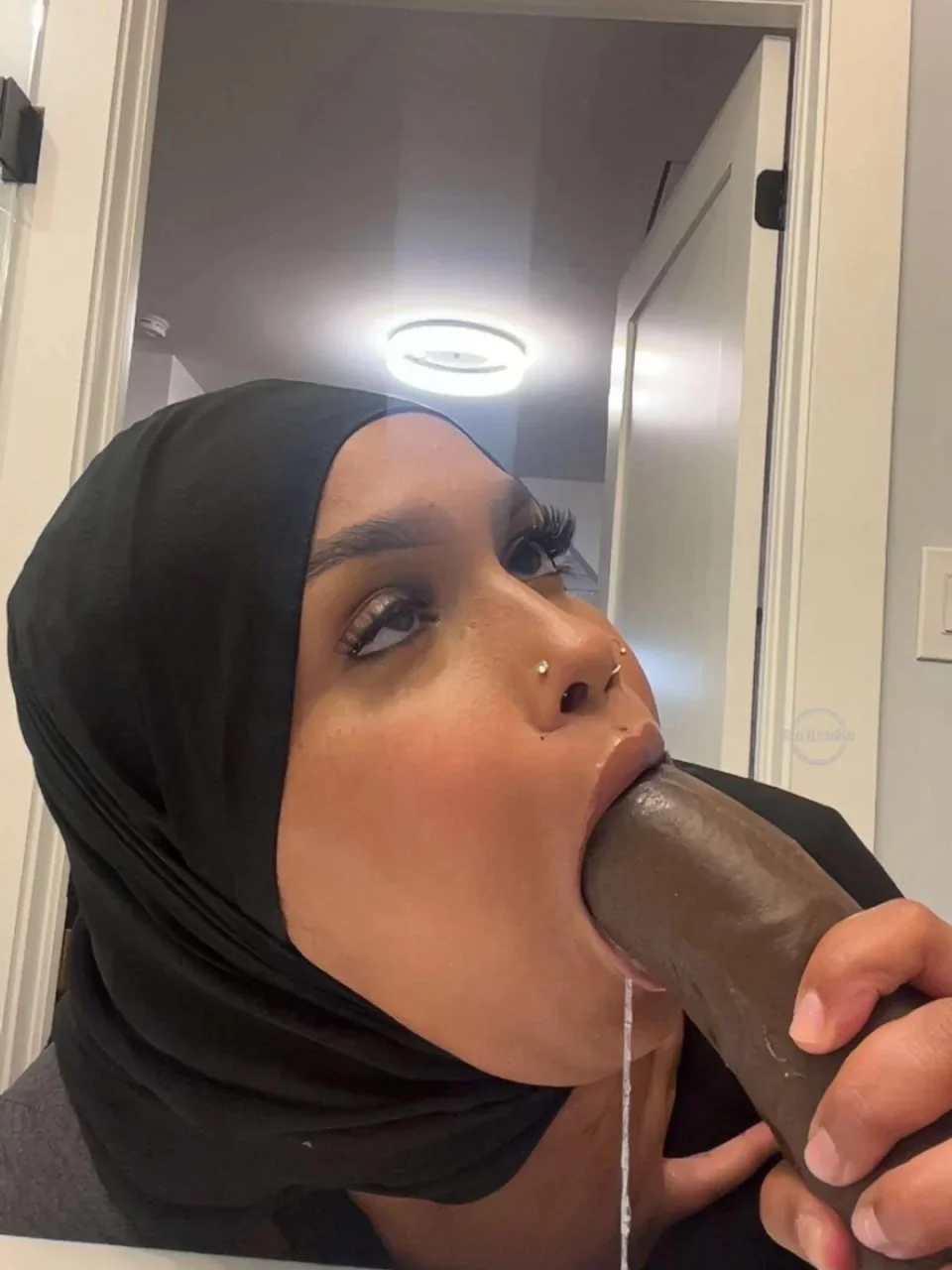 Somali chick deepthroating a dildo image 4