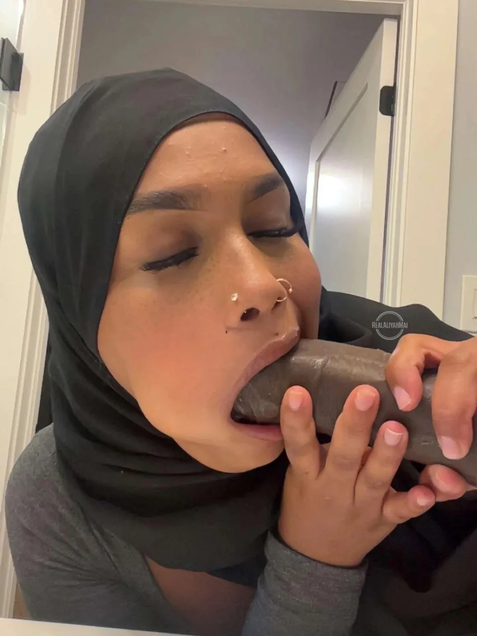 Somali chick deepthroating a dildo image 7