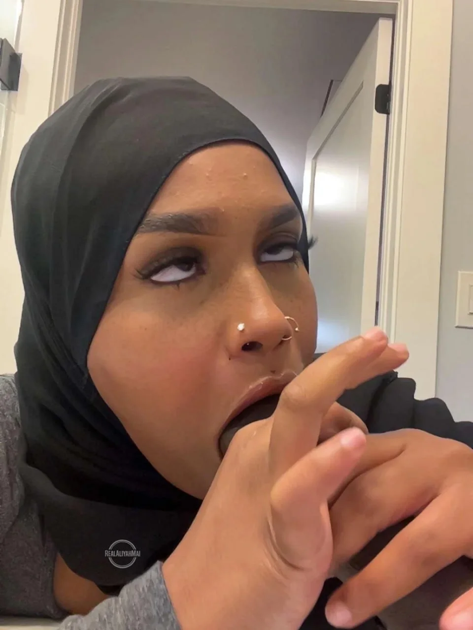 Somali chick deepthroating a dildo image 8