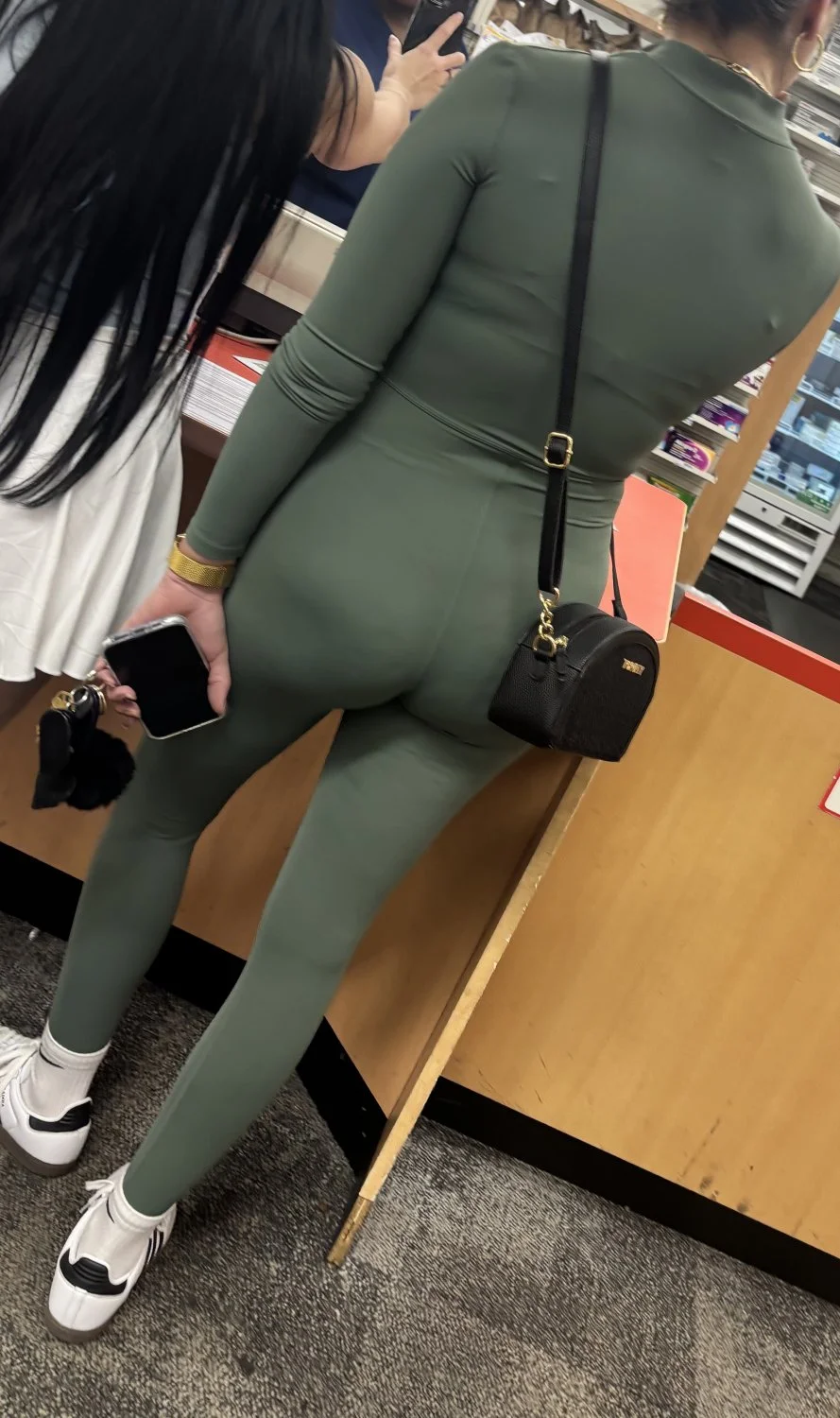 Green legging bending over image 14