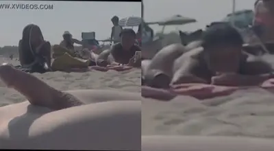 White guy cums infront of big ass Ebony on public beach cover image