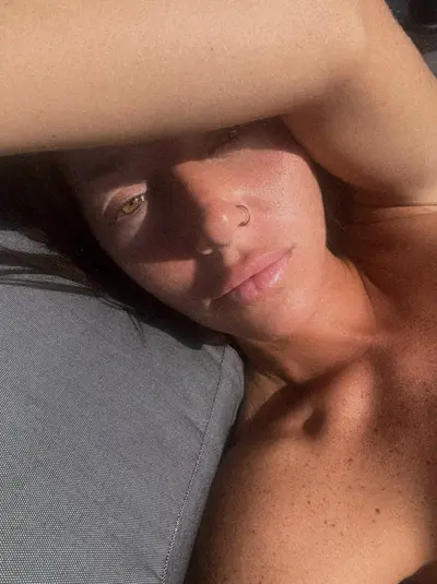 Letting the sun kiss my skin, while I steal your attention cover image