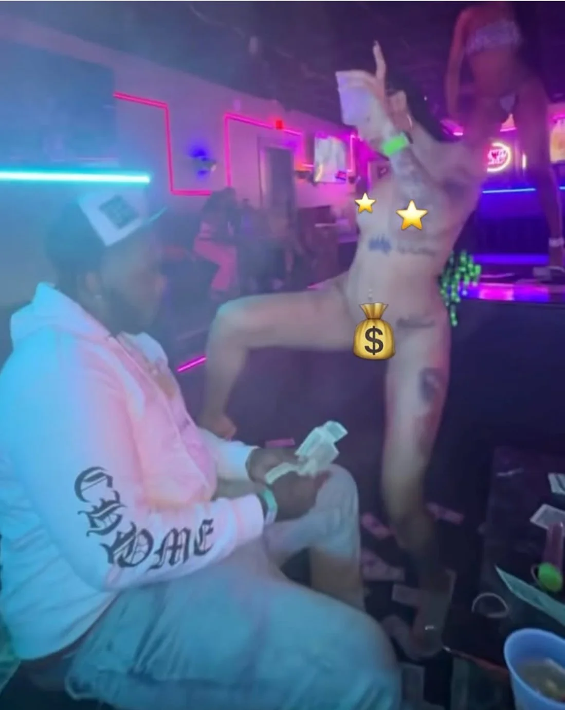 A man is having fun with 2 nude girls at the strip club image 5