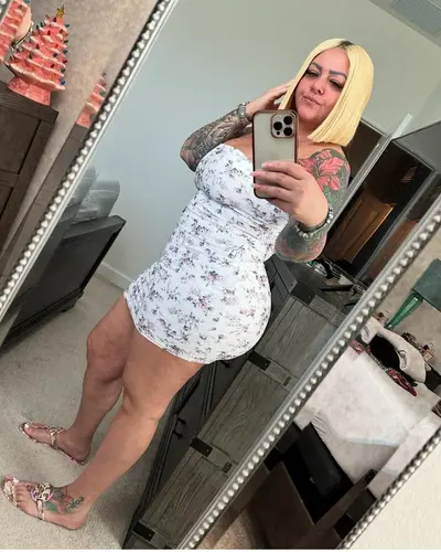 Old Tatted thot think she still got it. cover image