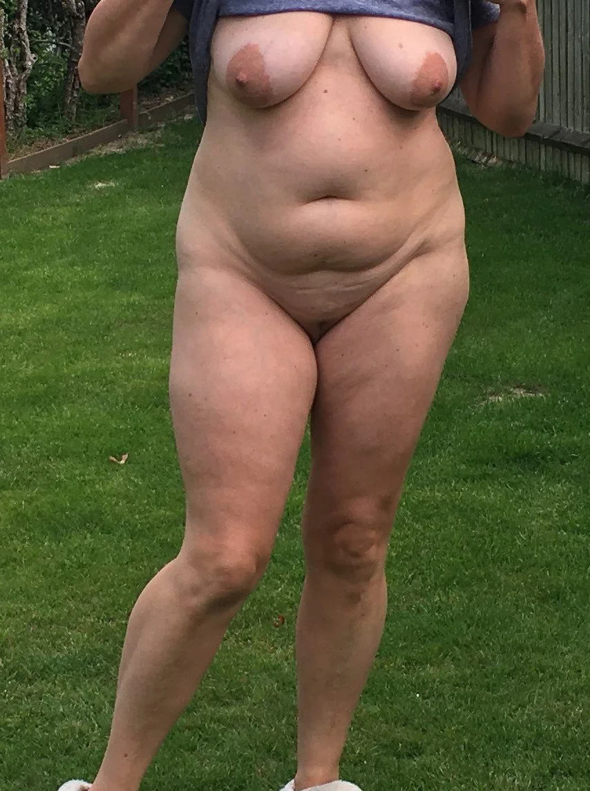 My UK chubby wife topless in public image 11