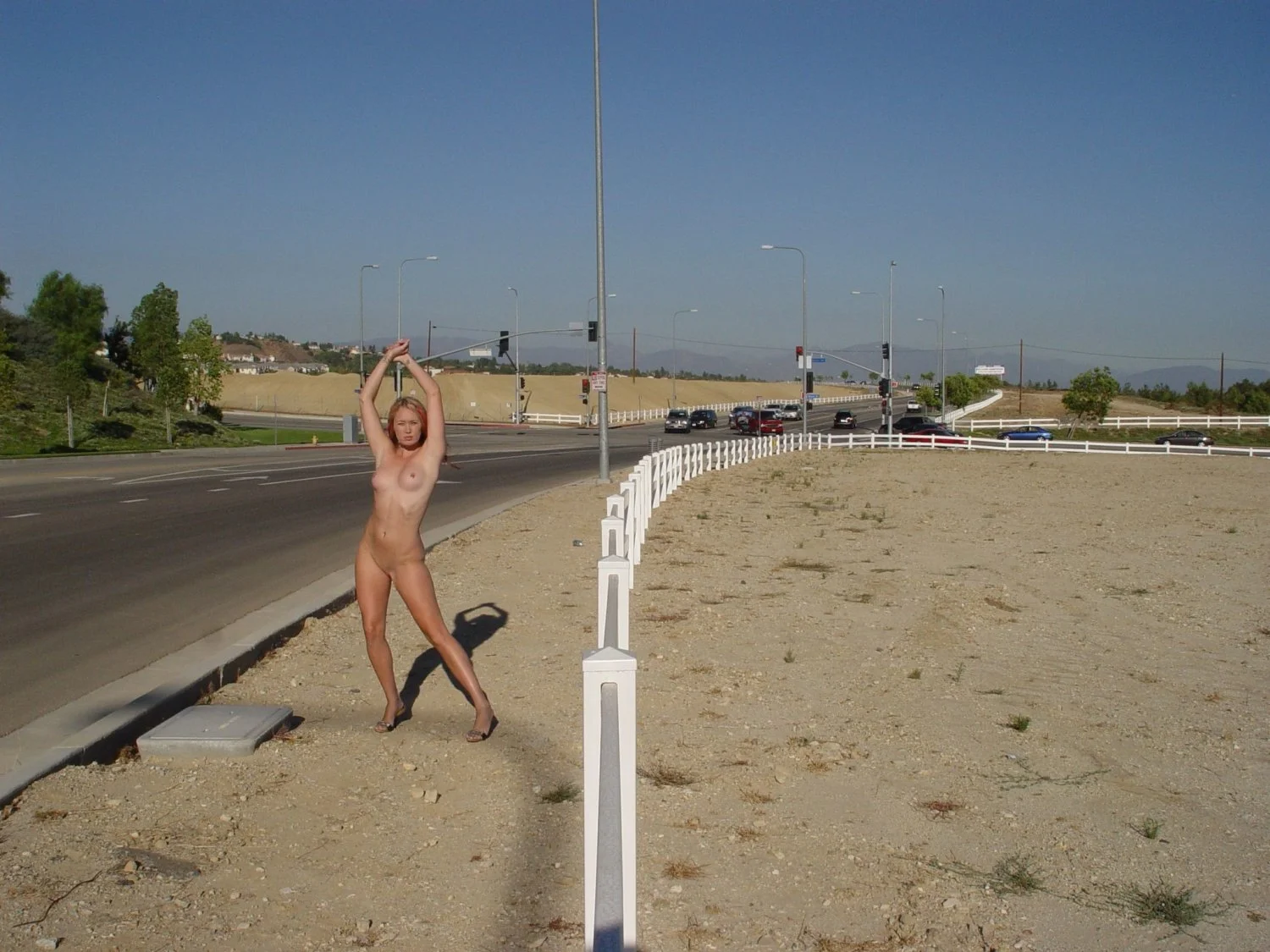 Daring Blonde completely naked in public image 3