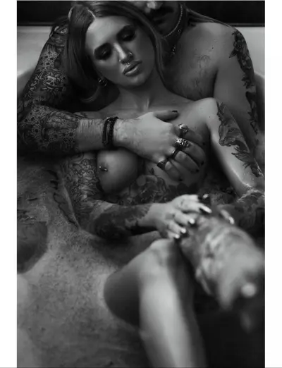 Tattoo couple boudoir cover image