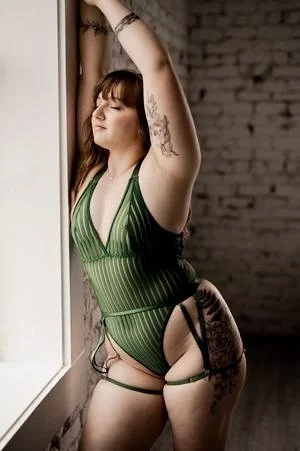 Showing off her best ASSets brunette boudoir image 2
