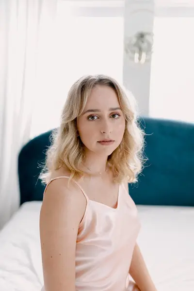 Busty brown eyed blonde boudoir cover image