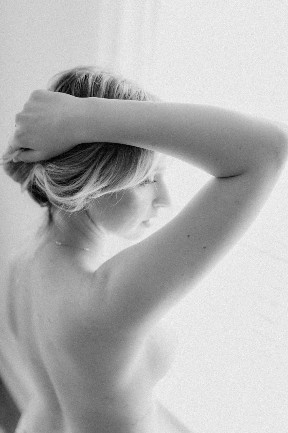 Busty brown eyed blonde boudoir image 35