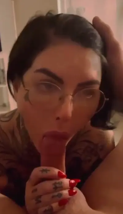 Tattooed brunette slut sucks horny cock cover image