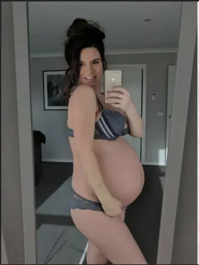pregnant babe amber shows off twin belly cover image