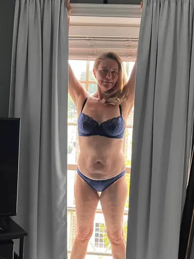 Dirty Blonde hotwife spreading her legs showing her pussy and ass after strip her underwear cover image