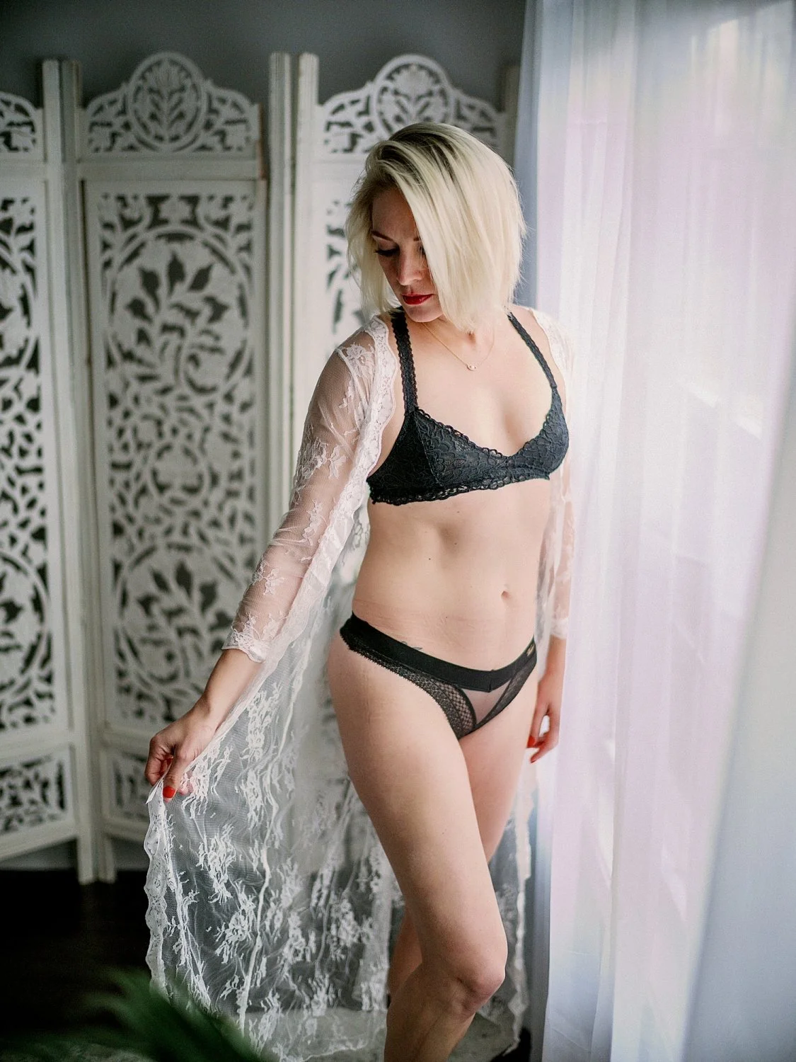 Petite green eyed blonde boudoir main image