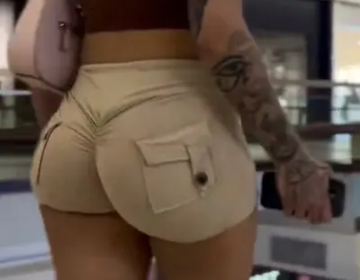 lightskin beauty’s cheeks are bursting out of booty shorts cover image