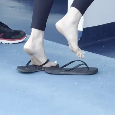 slut showing off her feet in public cover image