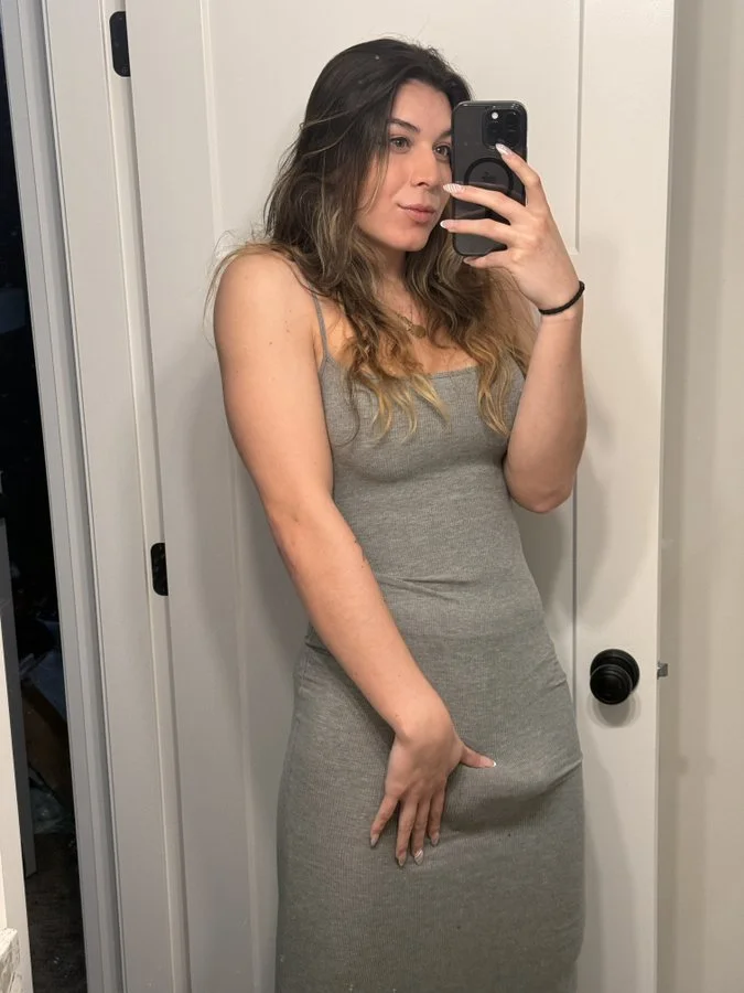 her tight grey dress doesn’t hide much image 3
