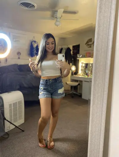 Girl showing her gorgeous feet in tory burch sandals dm for her instagram cover image