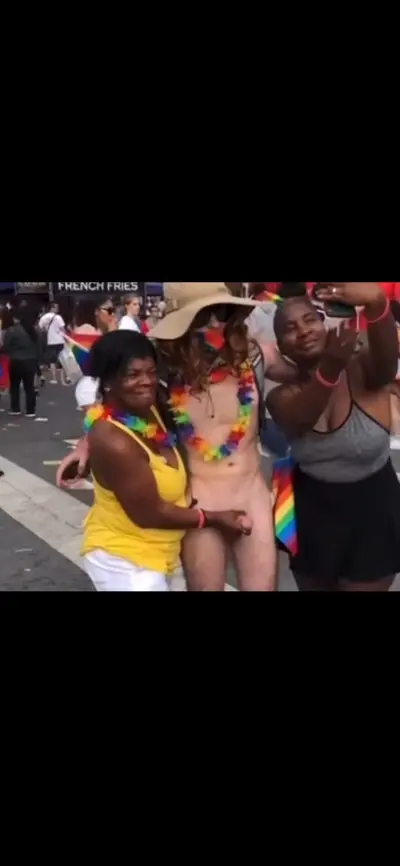 Mature Ebony jacks off white guy in public cover image