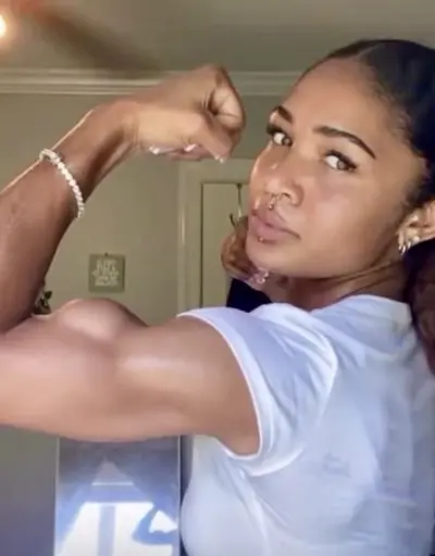 Natural Biceps, she don't even workout cover image