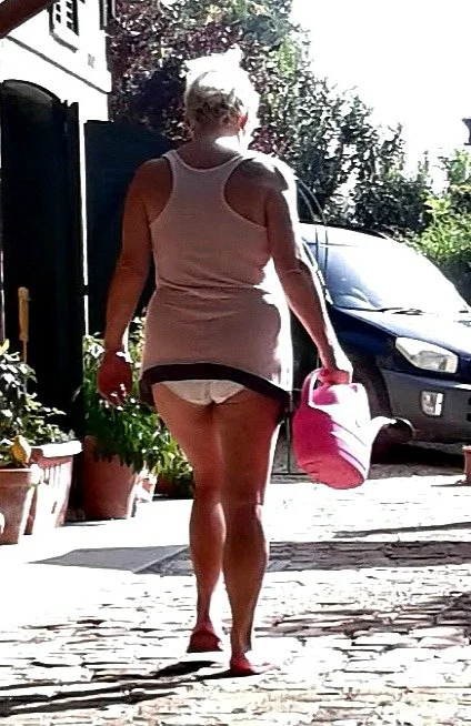 Giving the neighbours a glimpse of my mature thick body and big arse image 2