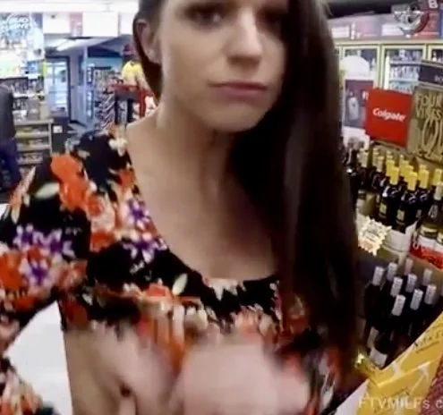 Young teacher flashing at local corner store main image