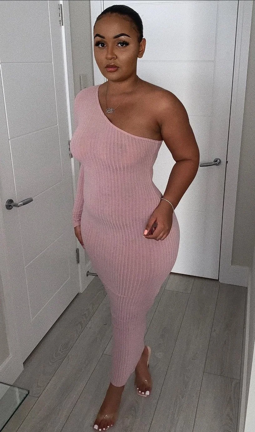 Do you think this dumb nigga knows everyone can see her dark black nipples through that dress? main image