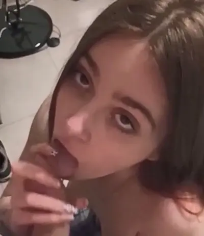 Petite teen cutie sucks until a messy cumshot facial cover image
