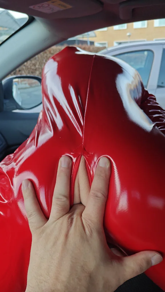 Finger in PVC catsuit image 6
