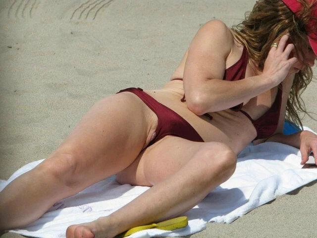 Pussy slip at the beach image 6