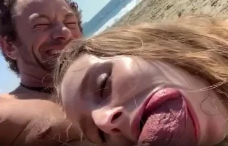 Horny blonde sucking cock in the beach main image