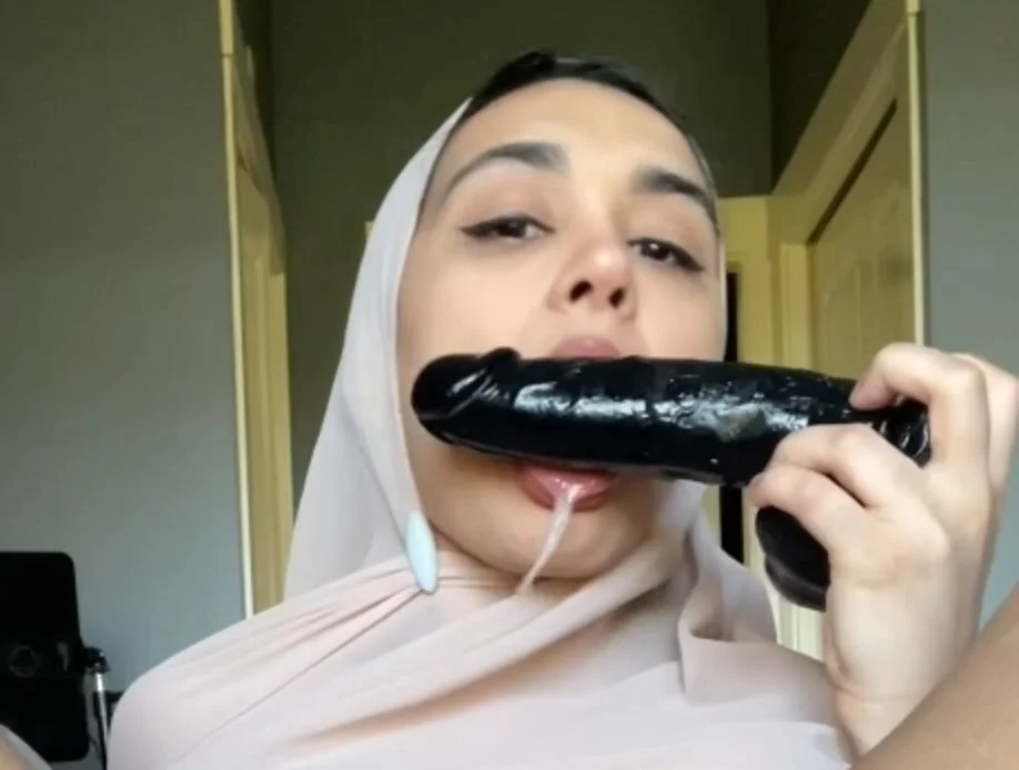 Pretty Hijabi creams and licks BBC dildo image 10