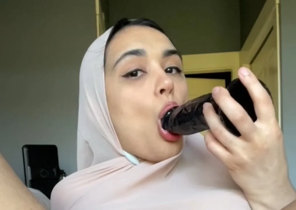 Pretty Hijabi creams and licks BBC dildo image 9