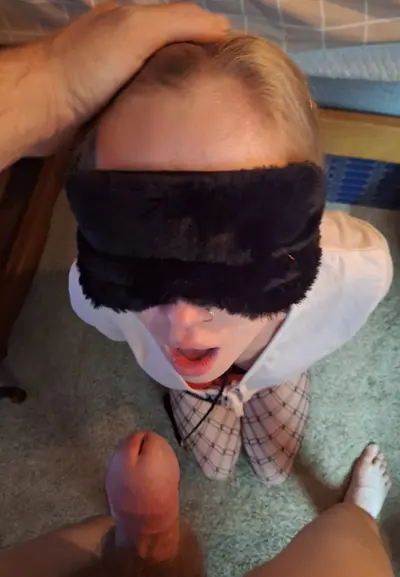 Blindfolded chicago slut gives blowjob cover image