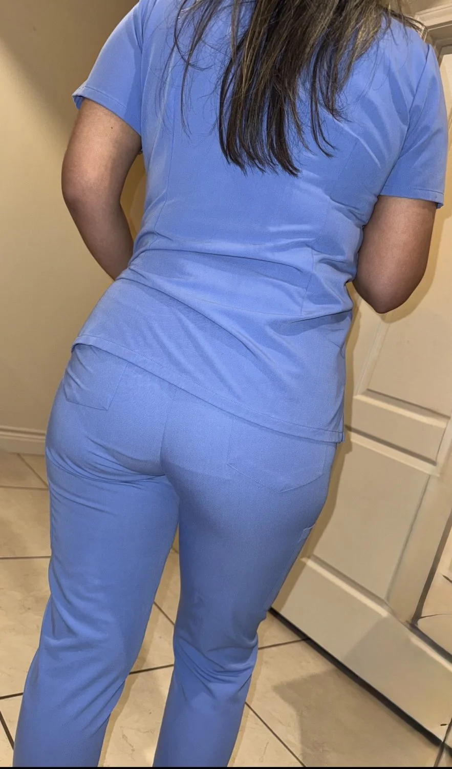 Panty outline visible thru her scrubs main image