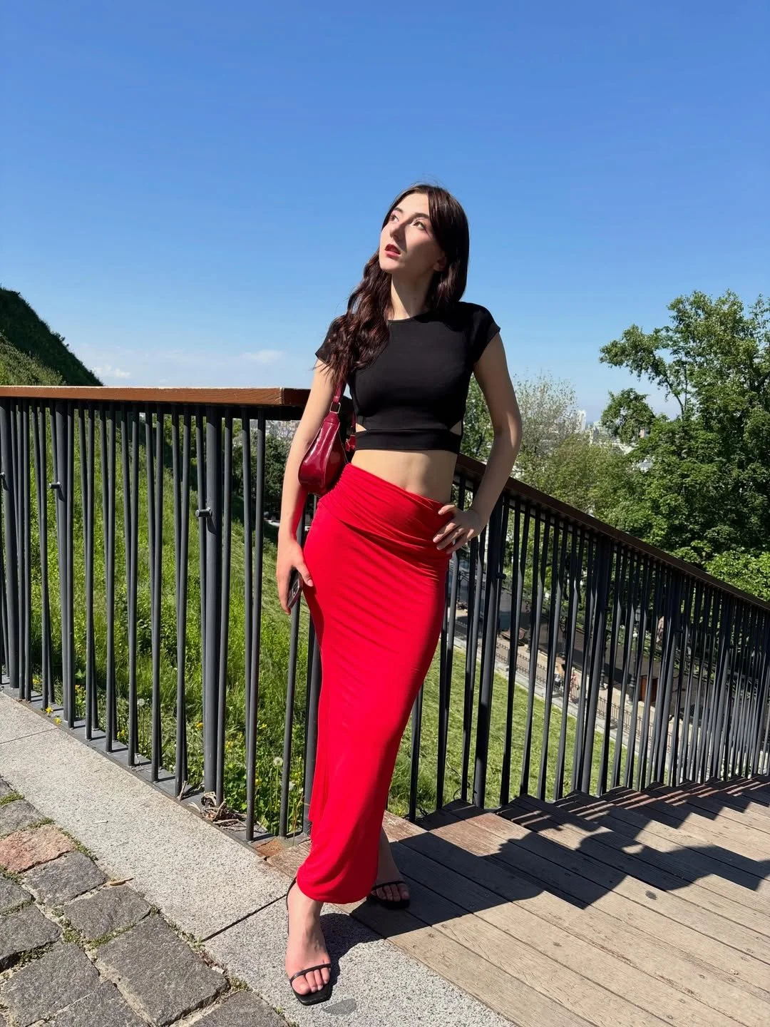 Red skirt and sexy feet. Caught image 9