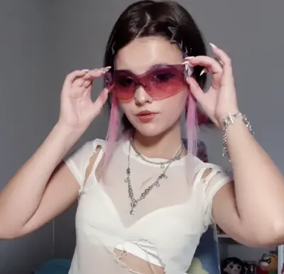 Teen raver girl plays with her tight pussy cover image
