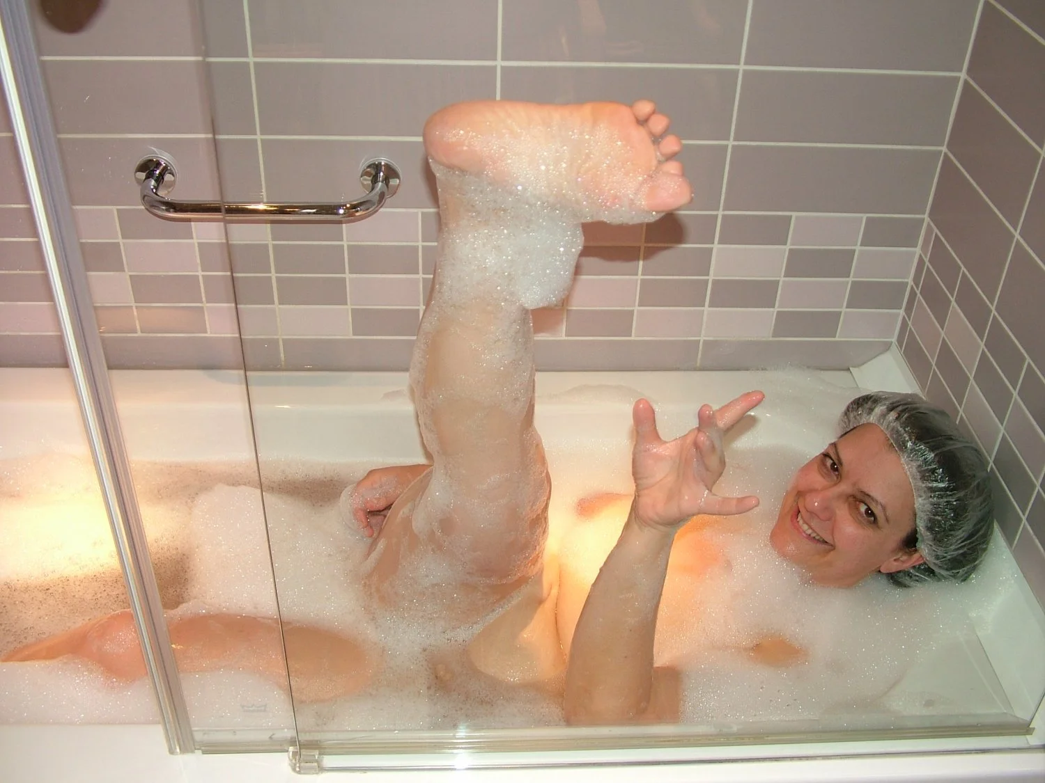 Young wife takes a hot bath main image