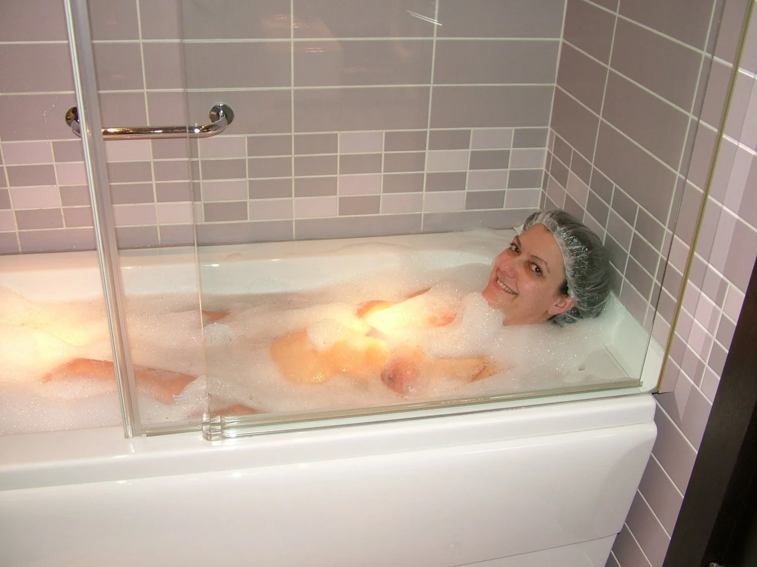 Young wife takes a hot bath image 2