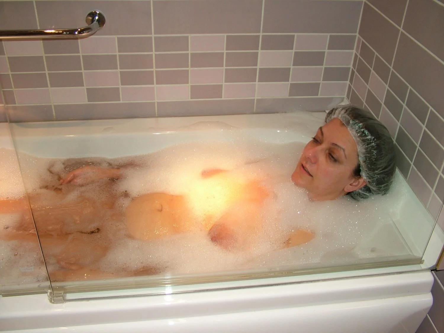 Young wife takes a hot bath image 3