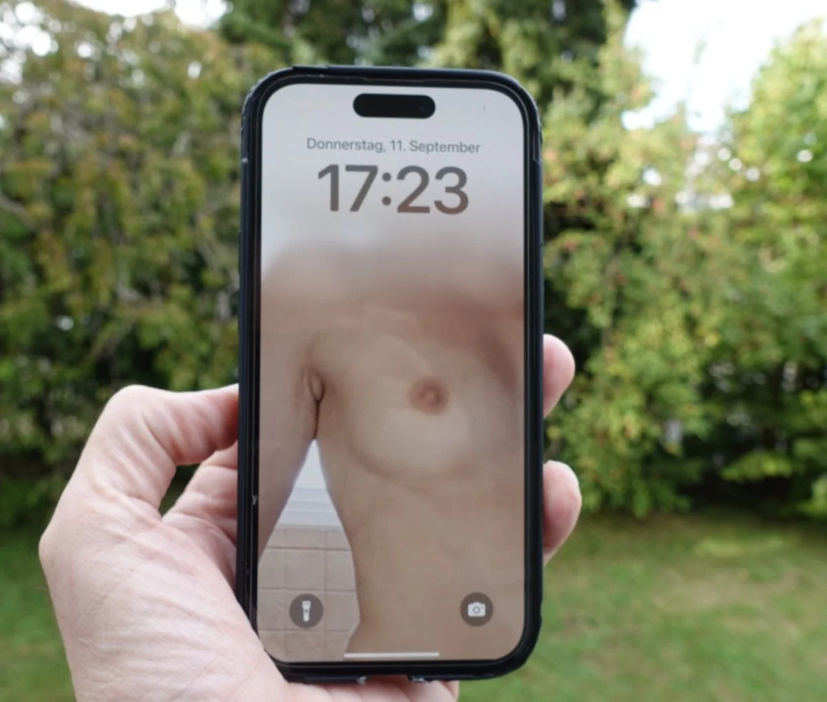 A stranger on erome used my wife's tits as his phone lockscreen in public image 3