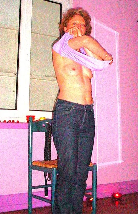 Mature redhead strips image 5